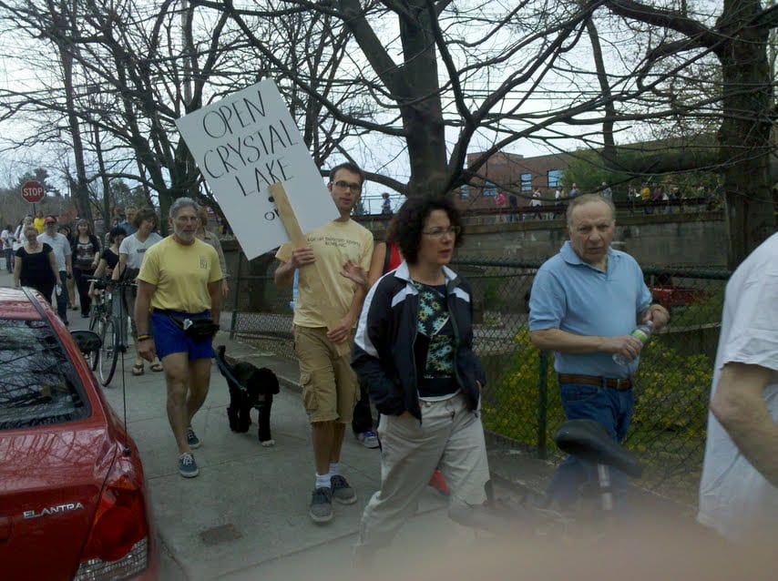 Protesters parade pond’s periphery — but is there any solution for Crystal Lake??