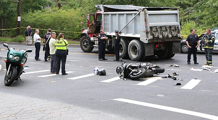 Motorcycle crash at Mill and Walnut Streets